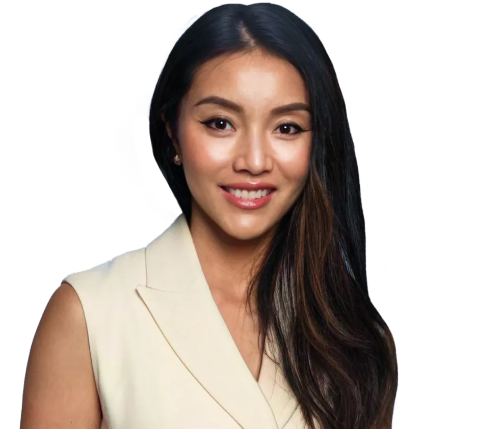 A portrait of a smiling woman with long dark hair, wearing a light-colored sleeveless blazer, against a transparent background. The image appears to be edited for design or professional use.